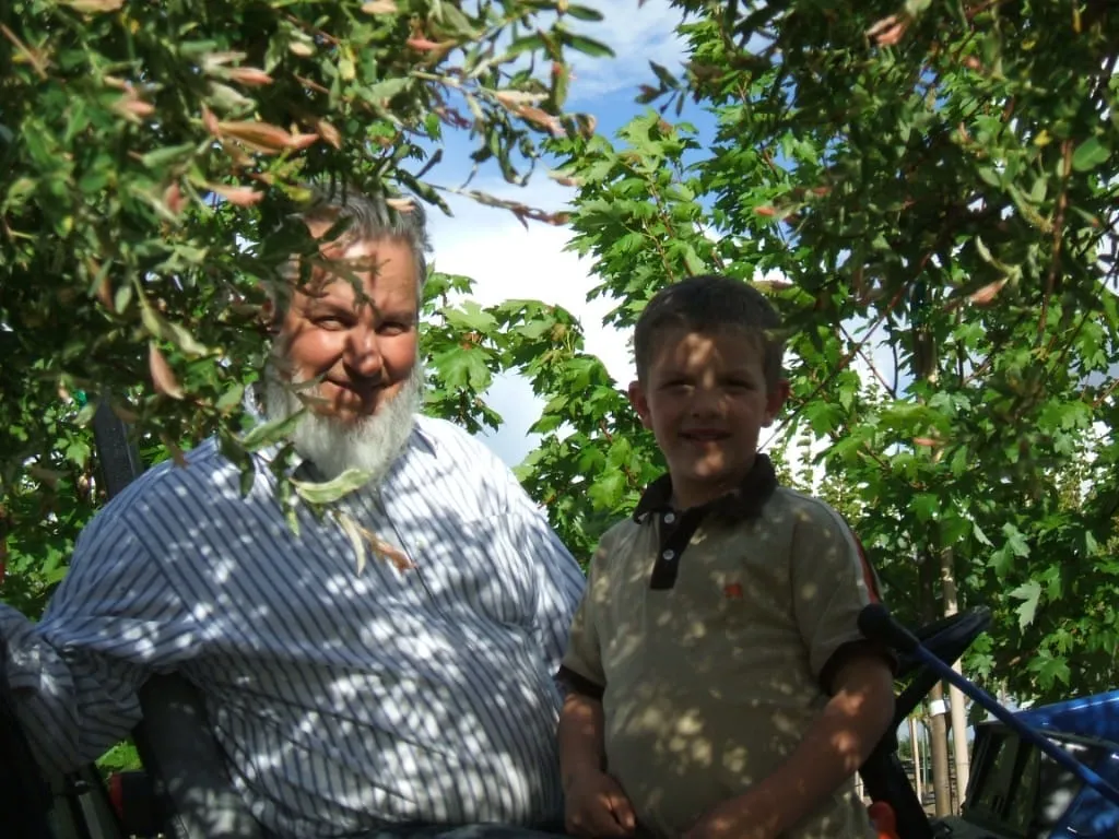 Family among pot-in-pot trees